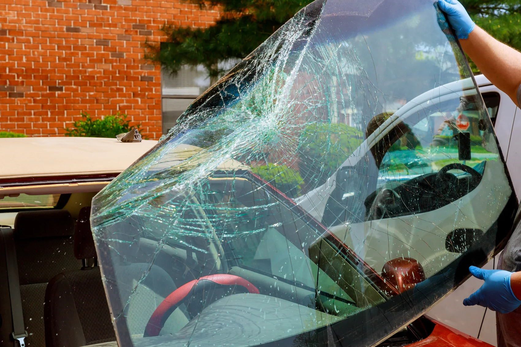 Cornerstone auto glass services replacing a smashed car windshield in Colorado